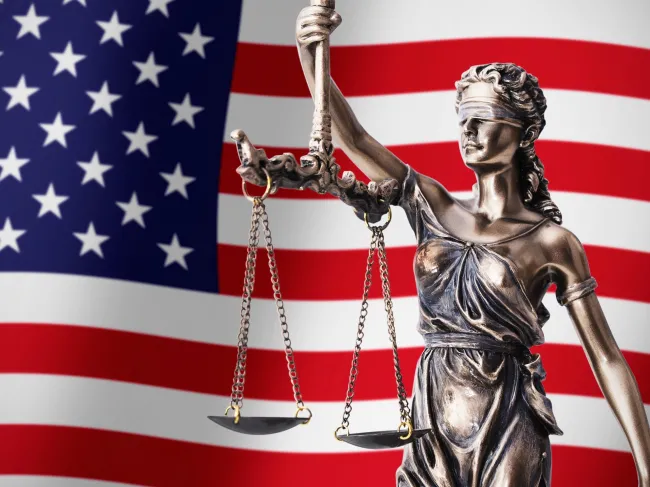 lady justice and US flag